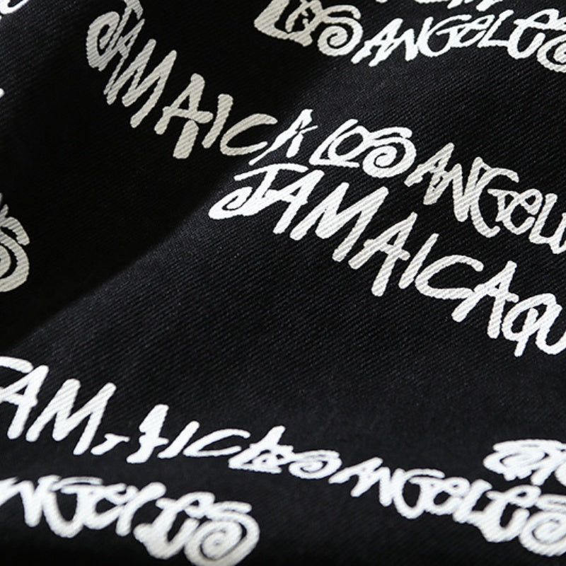 American-style baseball jacket Stu x Tears American High-Street Collaboration: Denim Jacket Featuring All-Over "Barrage" Text Print and Embroidered Cotton Boll Motifs.
