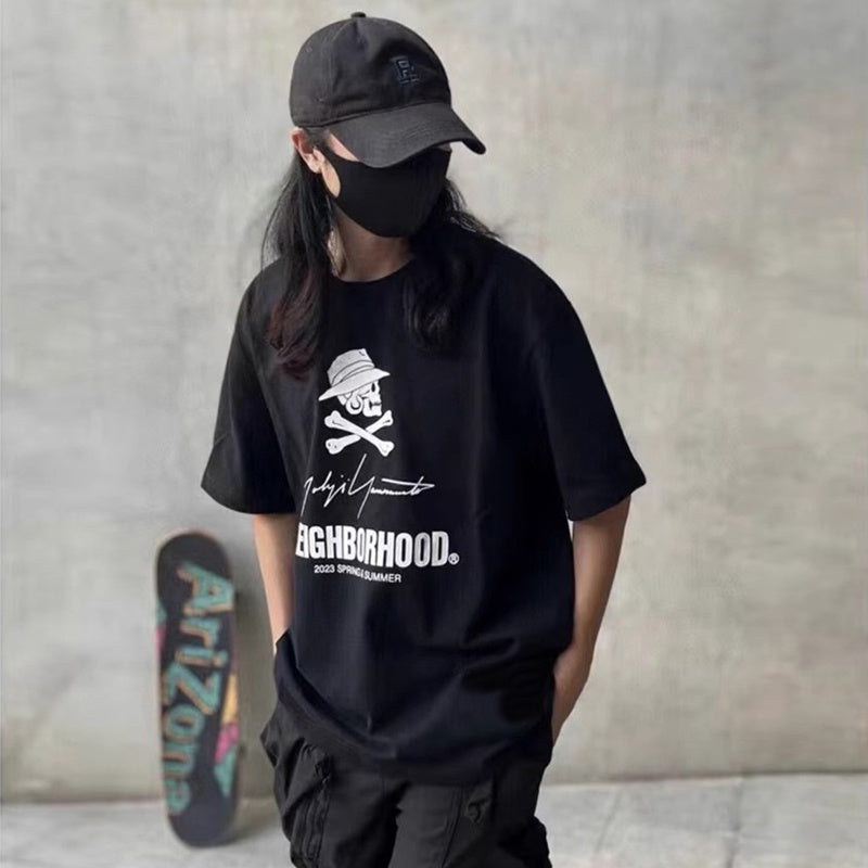 Mens T-shirt NBHD x Yohji Yamamoto collaboration featuring a signature slogan print.