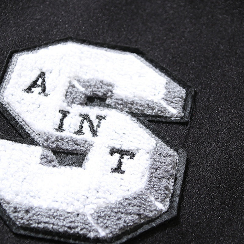 American-style baseball jacket High-street "Saint of God" American-style color-block varsity jacket for men; loose-fit unisex design featuring leather sleeves and a wool-blend body.