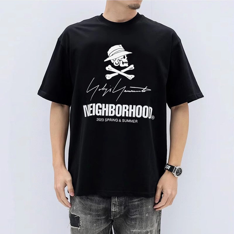 Mens T-shirt NBHD x Yohji Yamamoto collaboration featuring a signature slogan print.