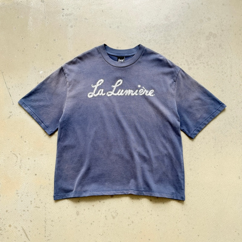 Unisex Vintage T Shirts SAINT MICHAEL "La Lumière" (French for "The Light") Limited Edition. Features heavyweight 320g fabric (post-wash weight) that matches the original specifications, along with vintage-style single-stitch and "blind stitch" (top-