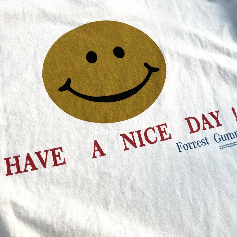 Unisex Vintage T Shirts "Have a nice day!" — Limited-edition smiley face design featuring direct-to-garment white ink printing; vintage style with a heavyweight, washed, and distressed finish.